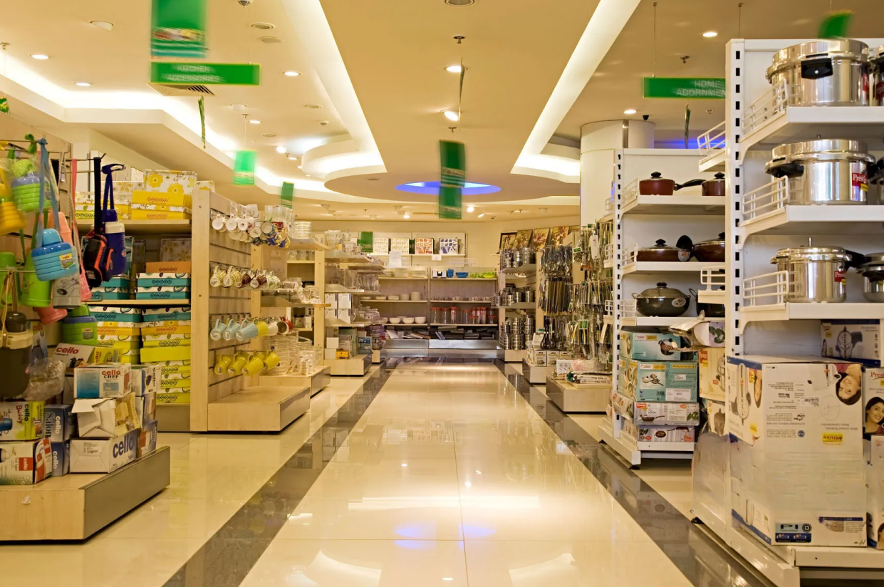 RetailWhizz supermarket ERP dashboard showing real-time sales, stock and cashier performance across multiple outlets